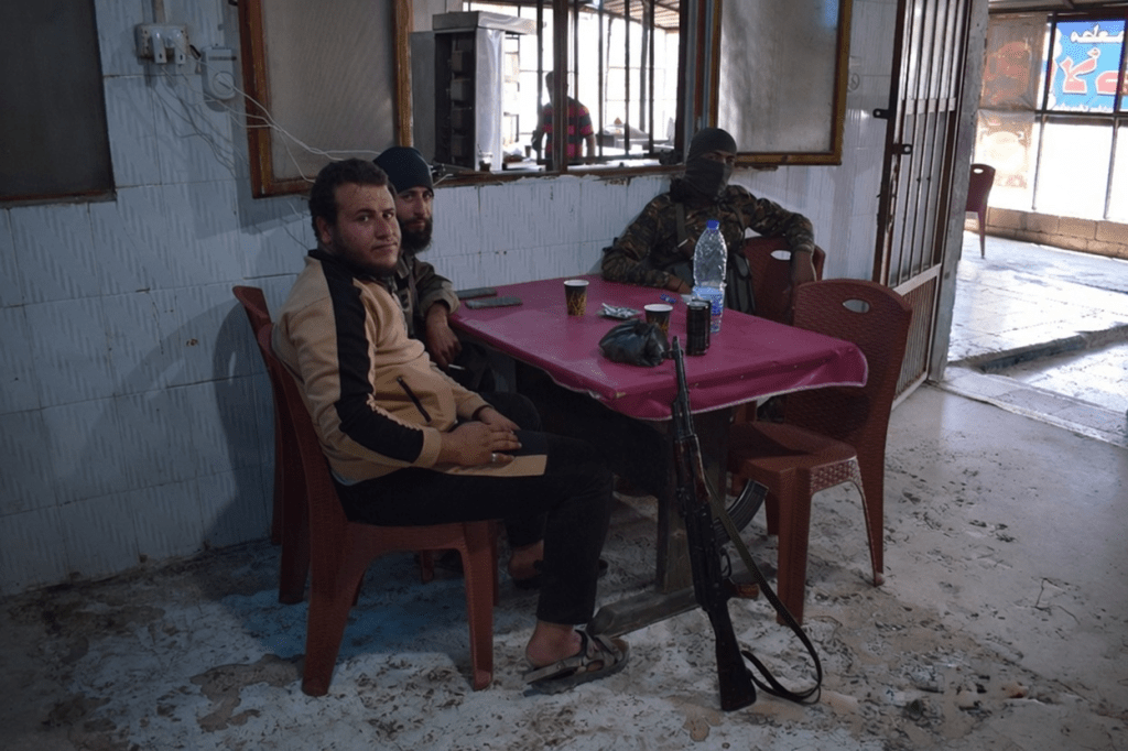 Islamists taking a break in a café in Syria.